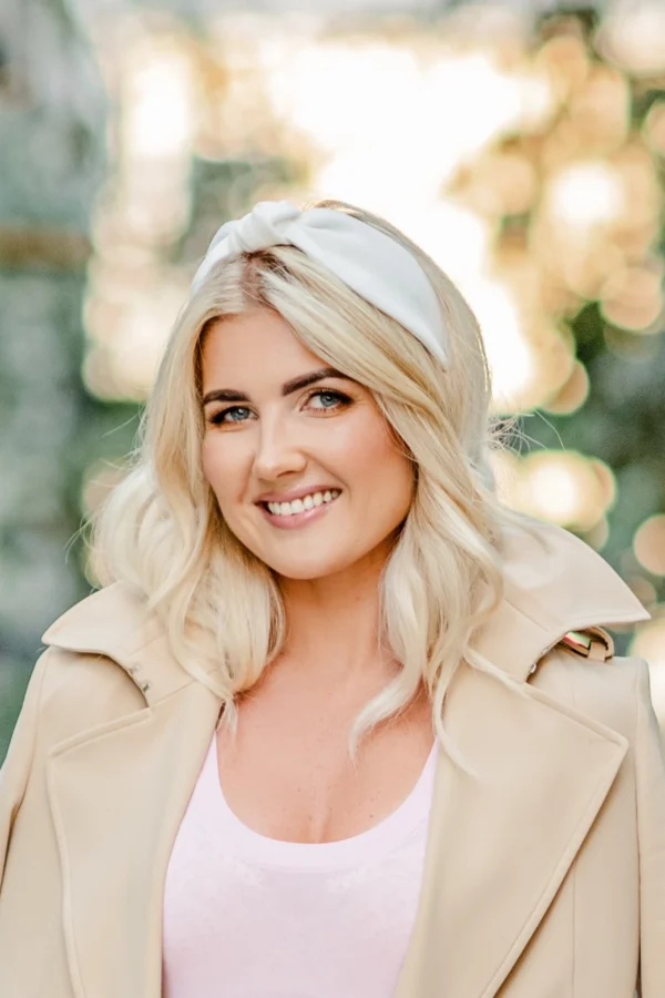 Blonde woman wearing white knotted headband